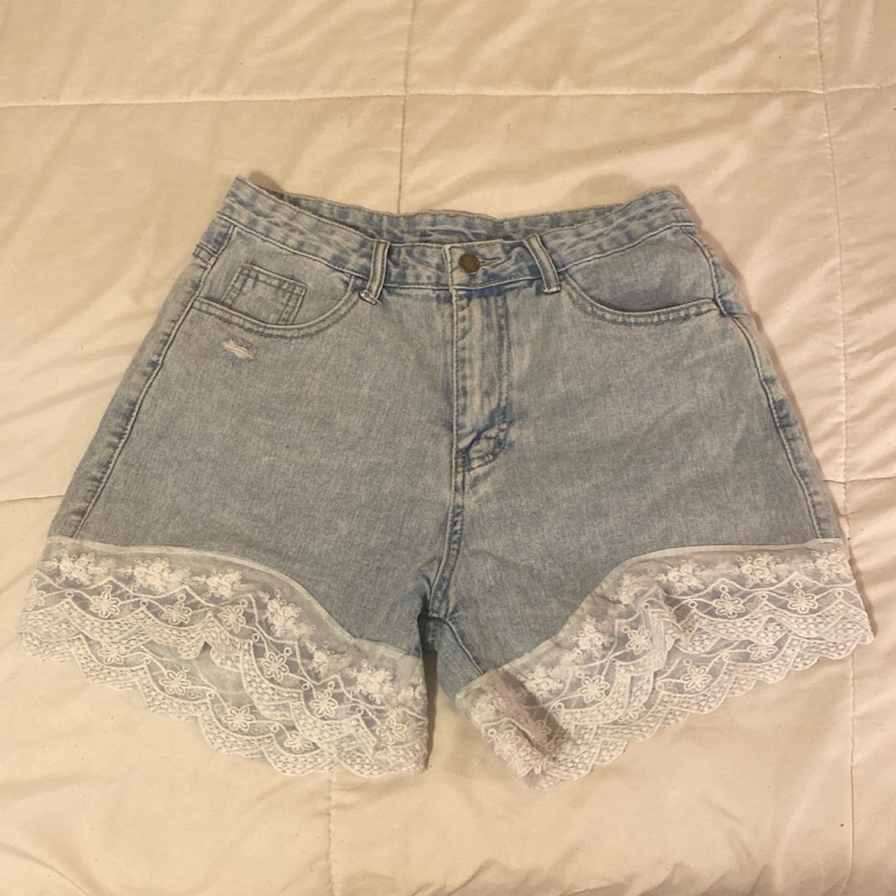 Denim shorts with lace on the bottom